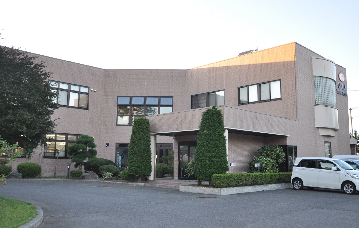 新工場を建設する「旭光通信システム」の八戸事業所=13日、八戸市北インター工業団地